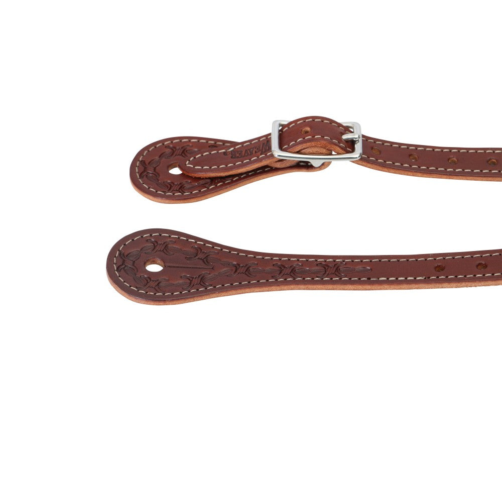 A close-up of a brown leather strap with tooled floral patterns, white stitching, and a silver metal buckle, shown against a plain white background.