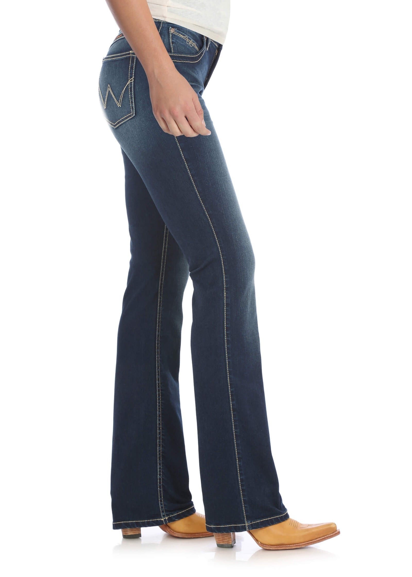 A side view of a woman wearing Wrangler Women's Q-Baby Ultimate Riding Jean, showing a mid-rise waist and boot cut design.