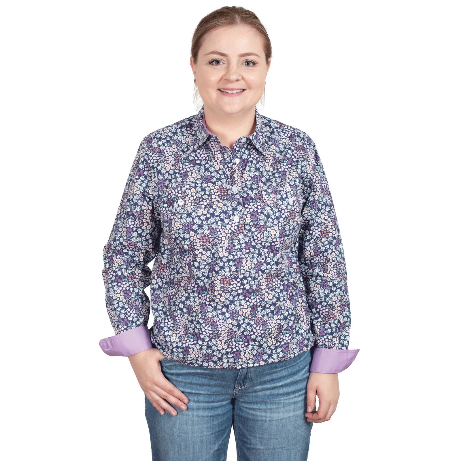 Just Country Women's Georgie Half Button L/S Shirt. A woman wearing a long-sleeved floral button-up shirt and jeans.