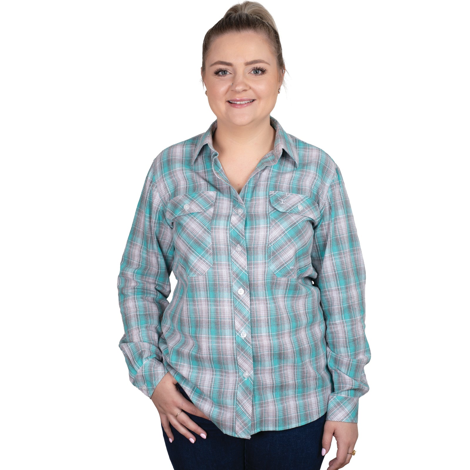 Just Country Women's Abbey Full Button Print Workshirt. A woman wearing a long-sleeved, full-button, plaid print workshirt in green and blue colors.