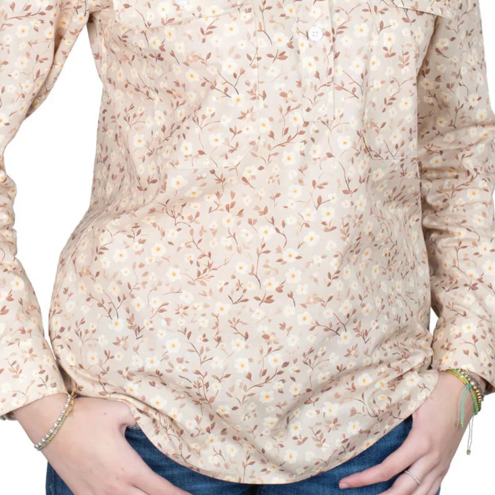 Beige floral blouse worn by a person on a white background