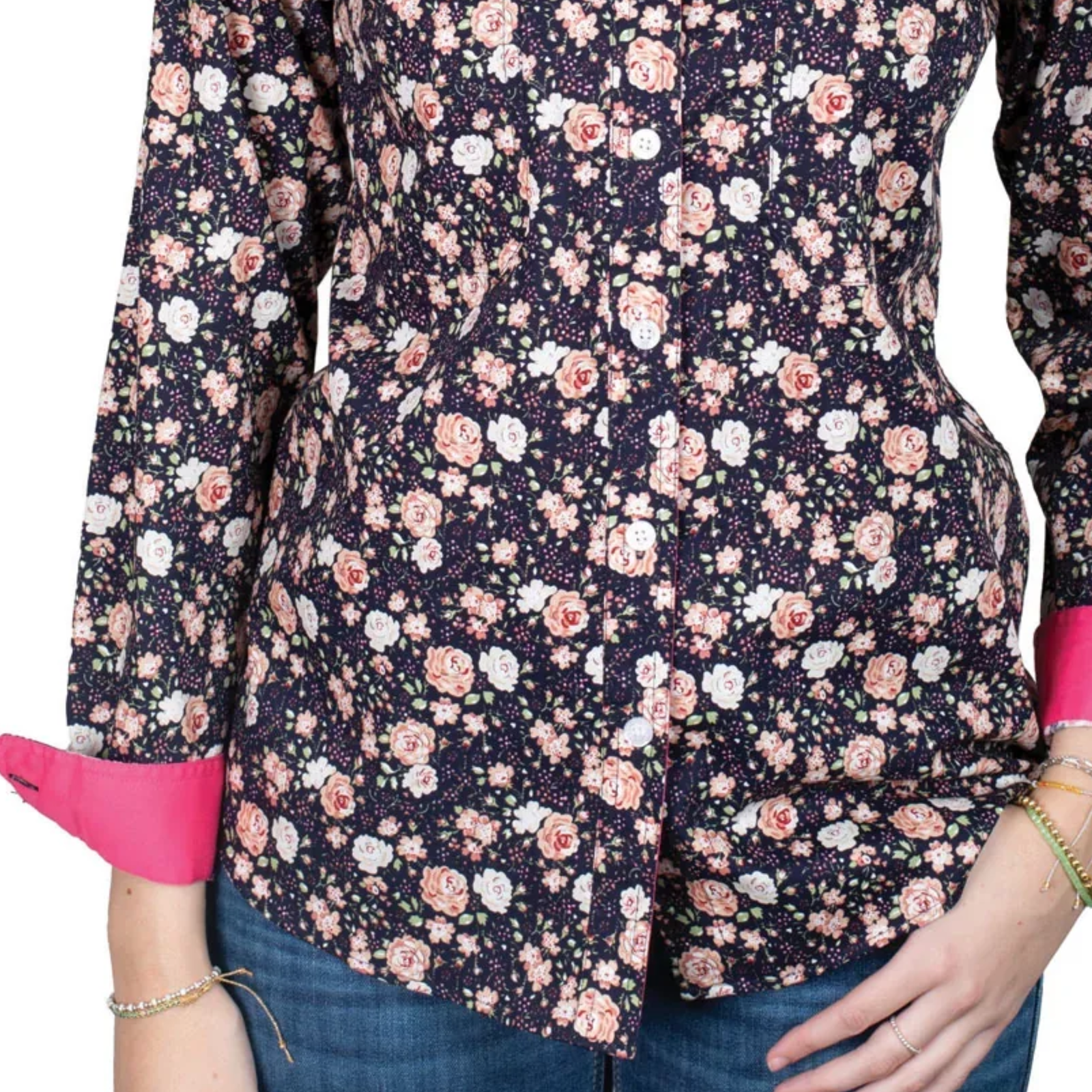 Floral patterned shirt with pink cuffs and trim on a white background