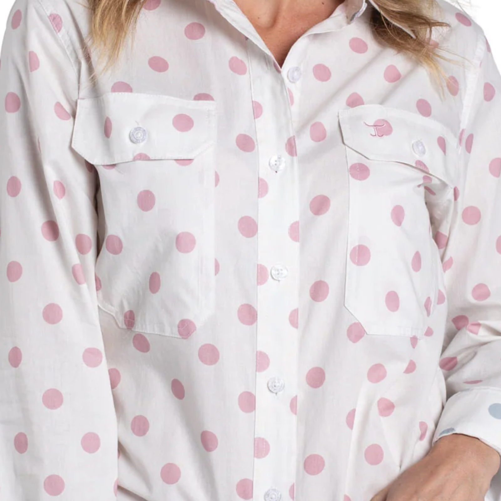 White shirt with pink polka dots worn by a person