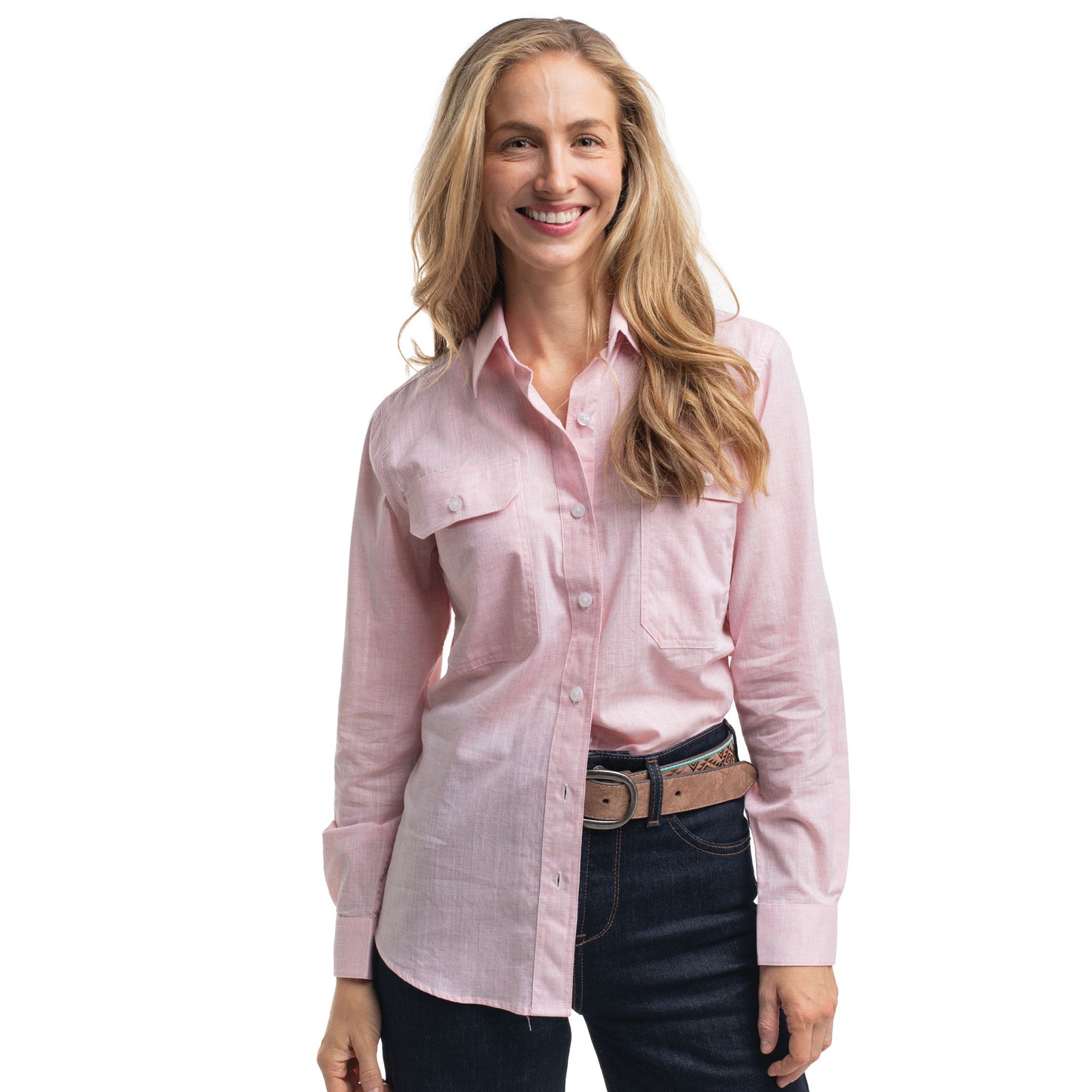 Woman wearing a pink shirt and dark jeans on a white background