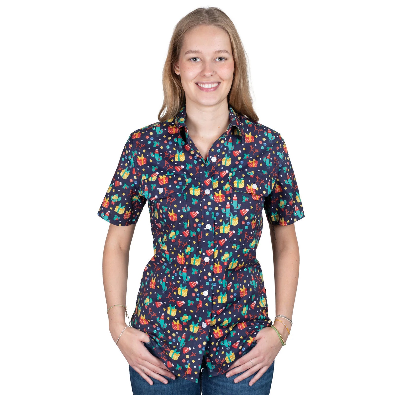 Just Country Women'sIzzy Full Button Print Short Sleeve Christmas Shirt. Woman wearing a colorful patterned shirt on a white background