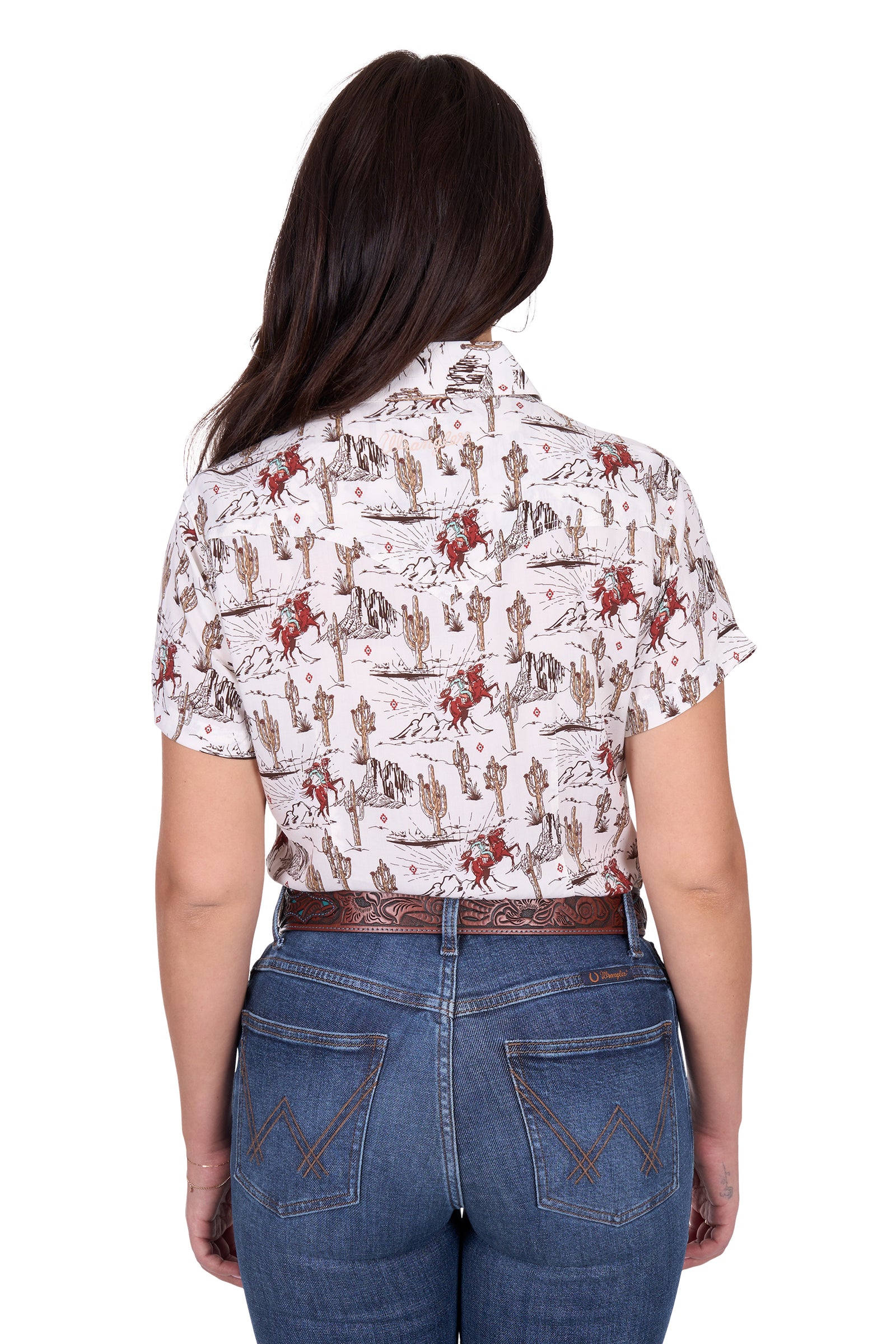 Wrangler Women's Celeste S/S Western Shirt. Person wearing a patterned shirt and jeans on a white background