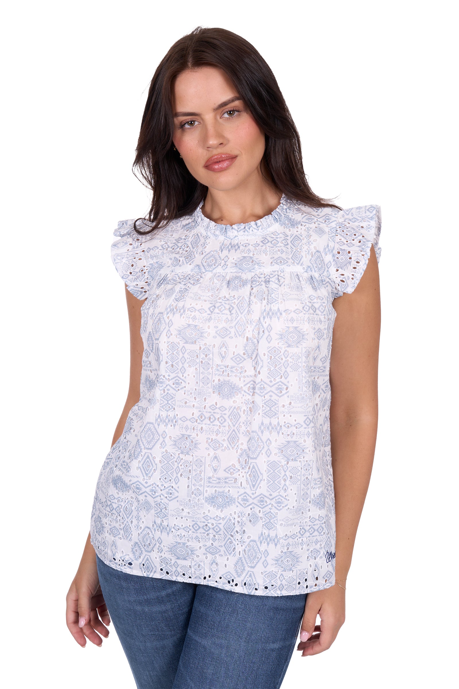 Wrangler Women's Harlow Sleeveless Blouse. Woman wearing a white lace top with blue jeans on a white background
