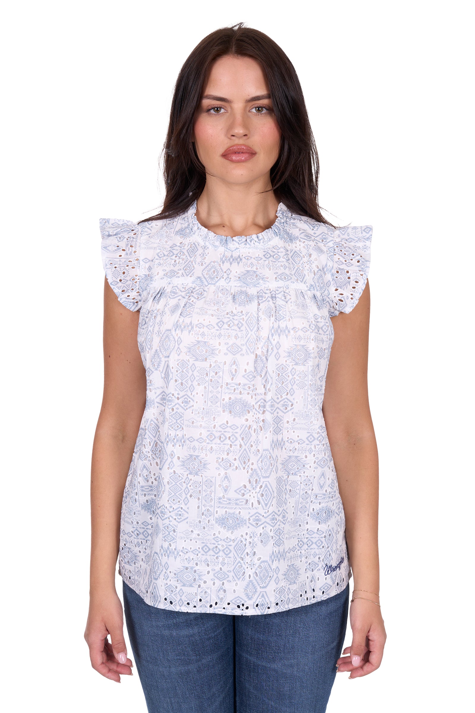Wrangler Women's Harlow Sleeveless Blouse. Woman wearing a white lace top with blue jeans on a white background
