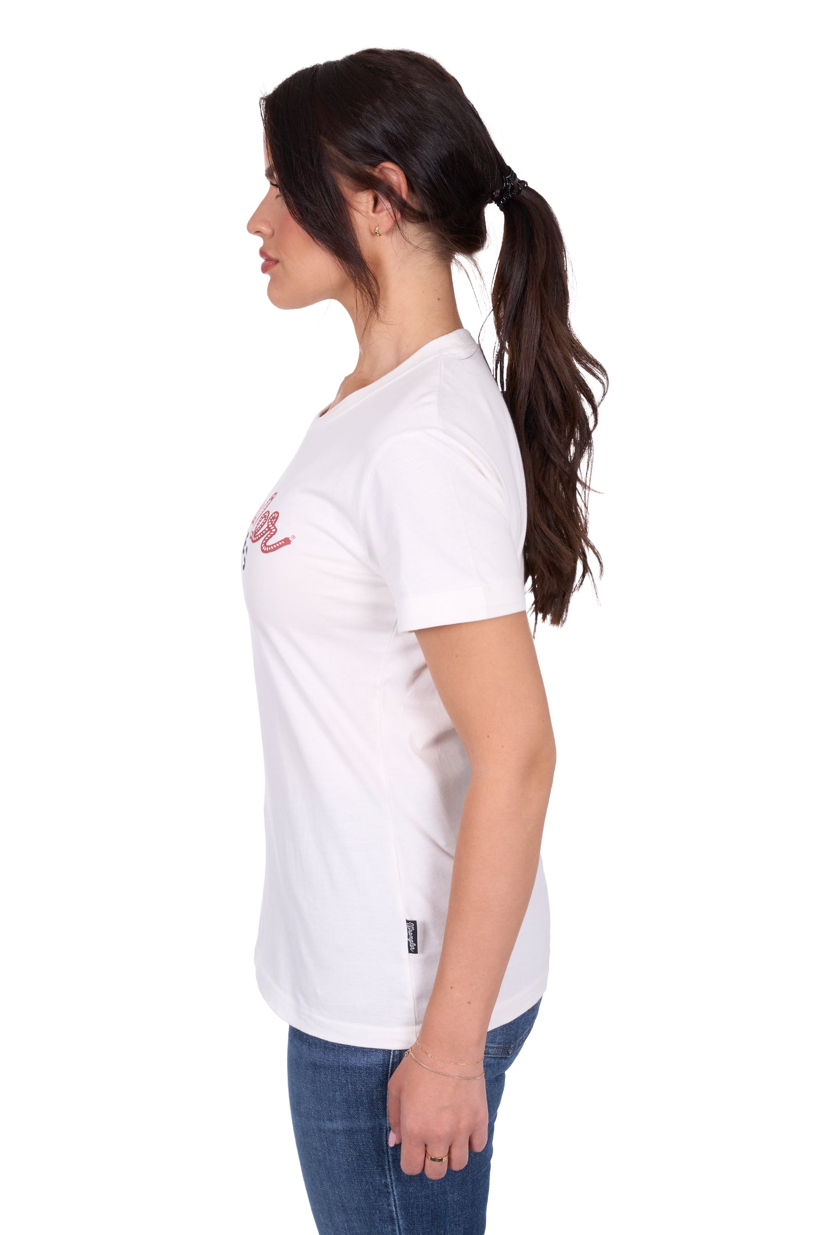 Wrangler Women's Piper S/S T-Shirt. Woman wearing a white t-shirt with a logo on a white background