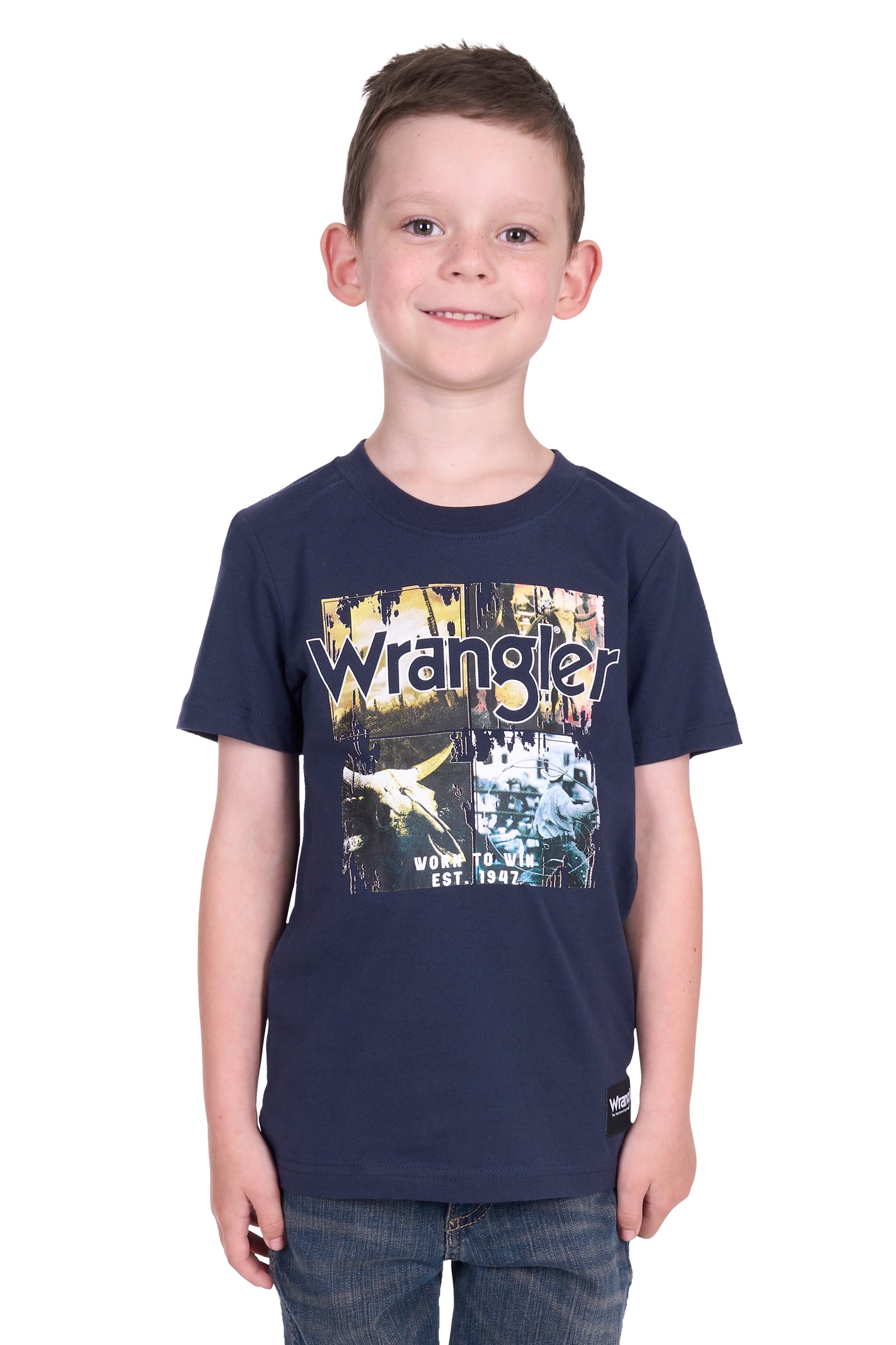 Wrangler Boy's Luis S/S T-Shirt. Child wearing a navy blue Wrangler t-shirt with a graphic design on a white background