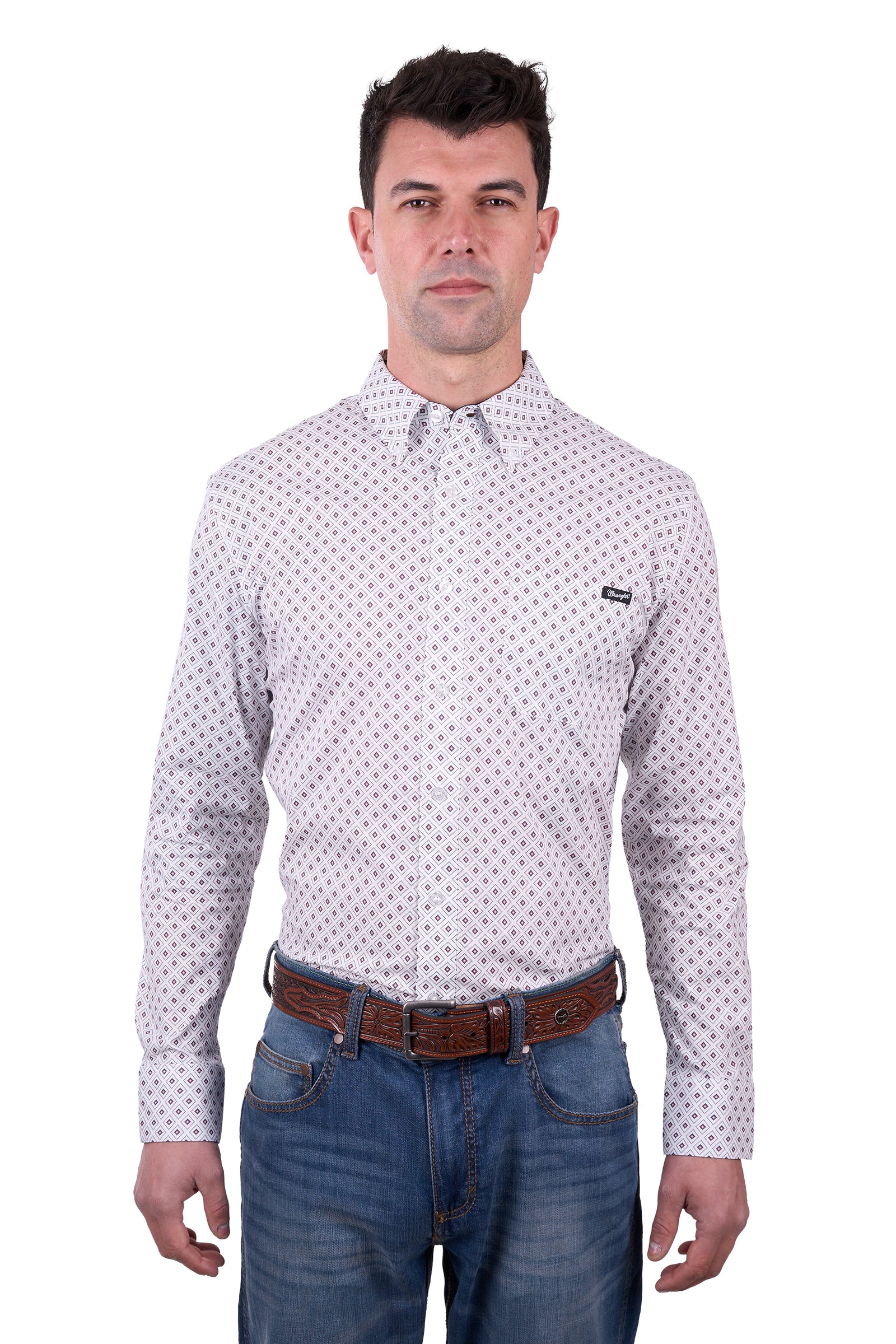 A man wearing a long-sleeved, button-down, checkered white and blue Wrangler Men's Knox Western Shirt with a pointed collar, paired with blue jeans and a brown belt.