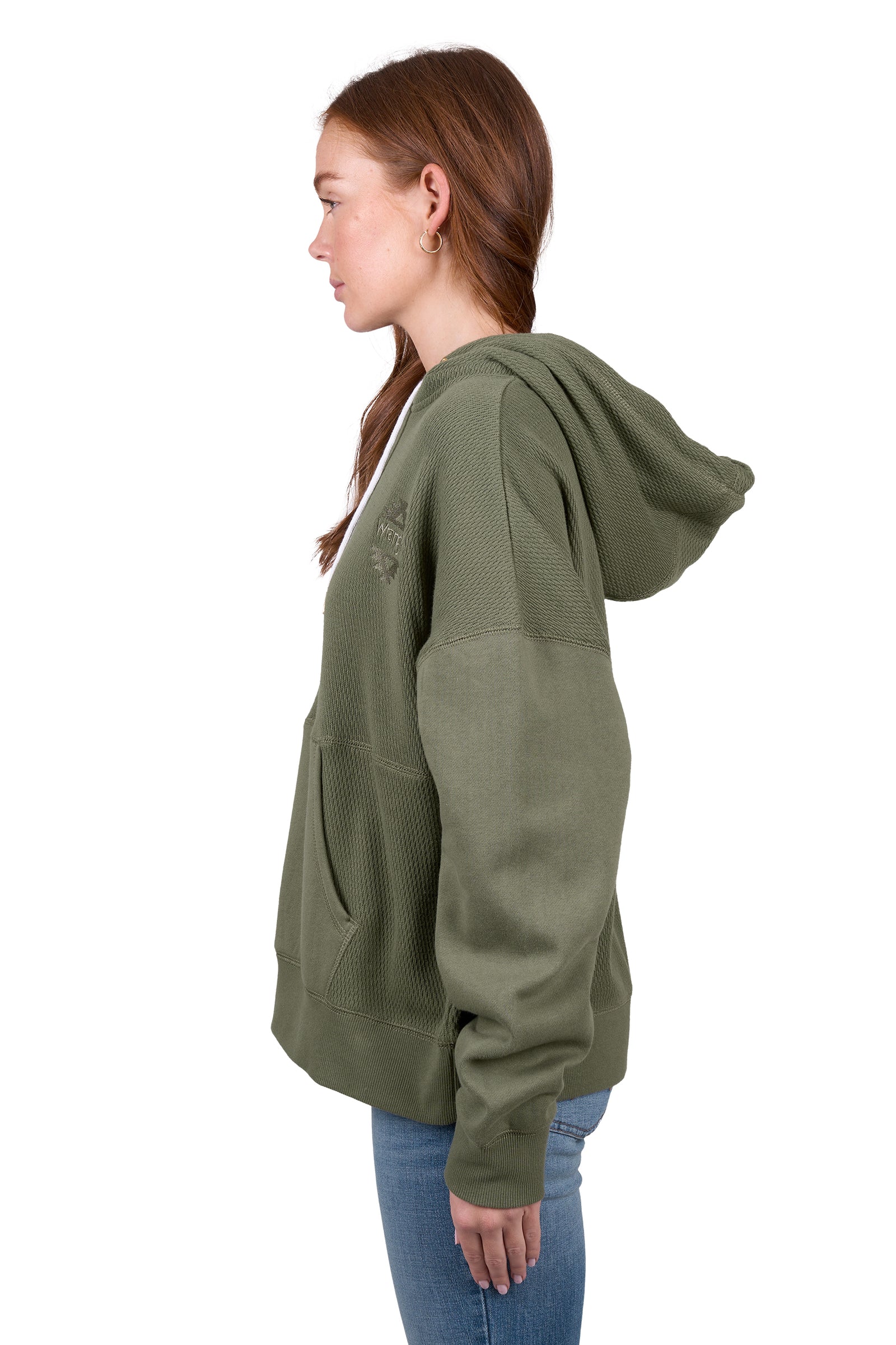 A woman wearing a green Wrangler Women's Lisa Hoodie with a front kangaroo pocket, hood with drawcord, and the Wrangler logo on the chest.
