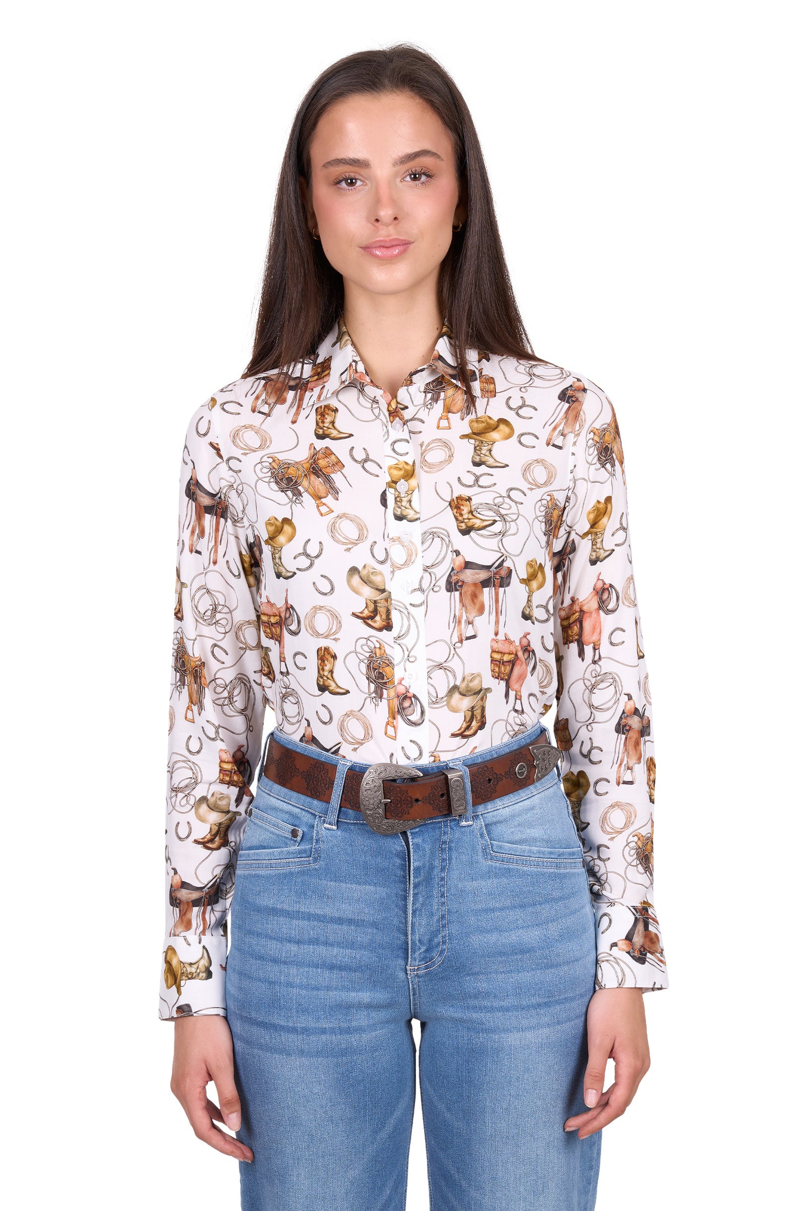 Woman wearing a patterned shirt with cowboy design and blue jeans on a white background
