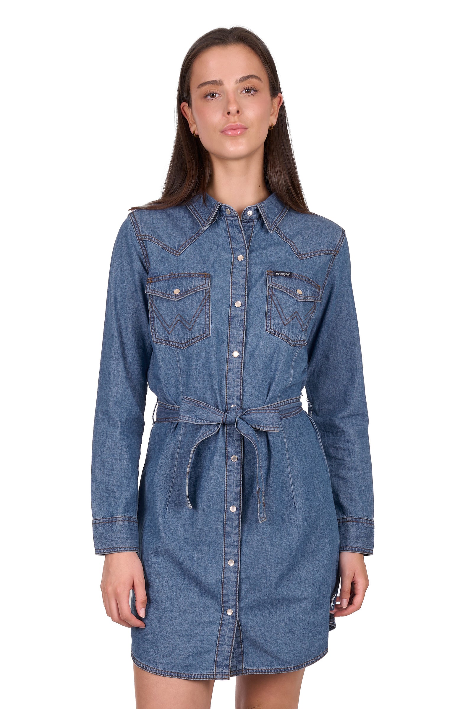 Woman wearing a blue denim dress on a white background