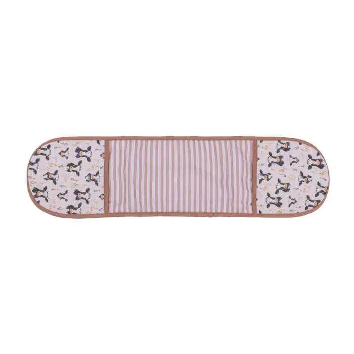 A rectangular baby blanket or mat with rounded corners, featuring a central panel of vertical pink and white stripes, flanked by patterned ends with black and white dog silhouettes on a pale pink background.