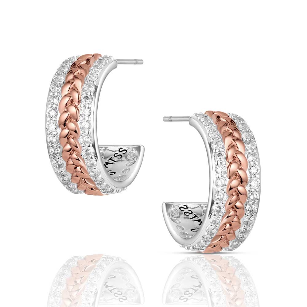 Pair of hoop earrings with rose gold and silver design on a white background