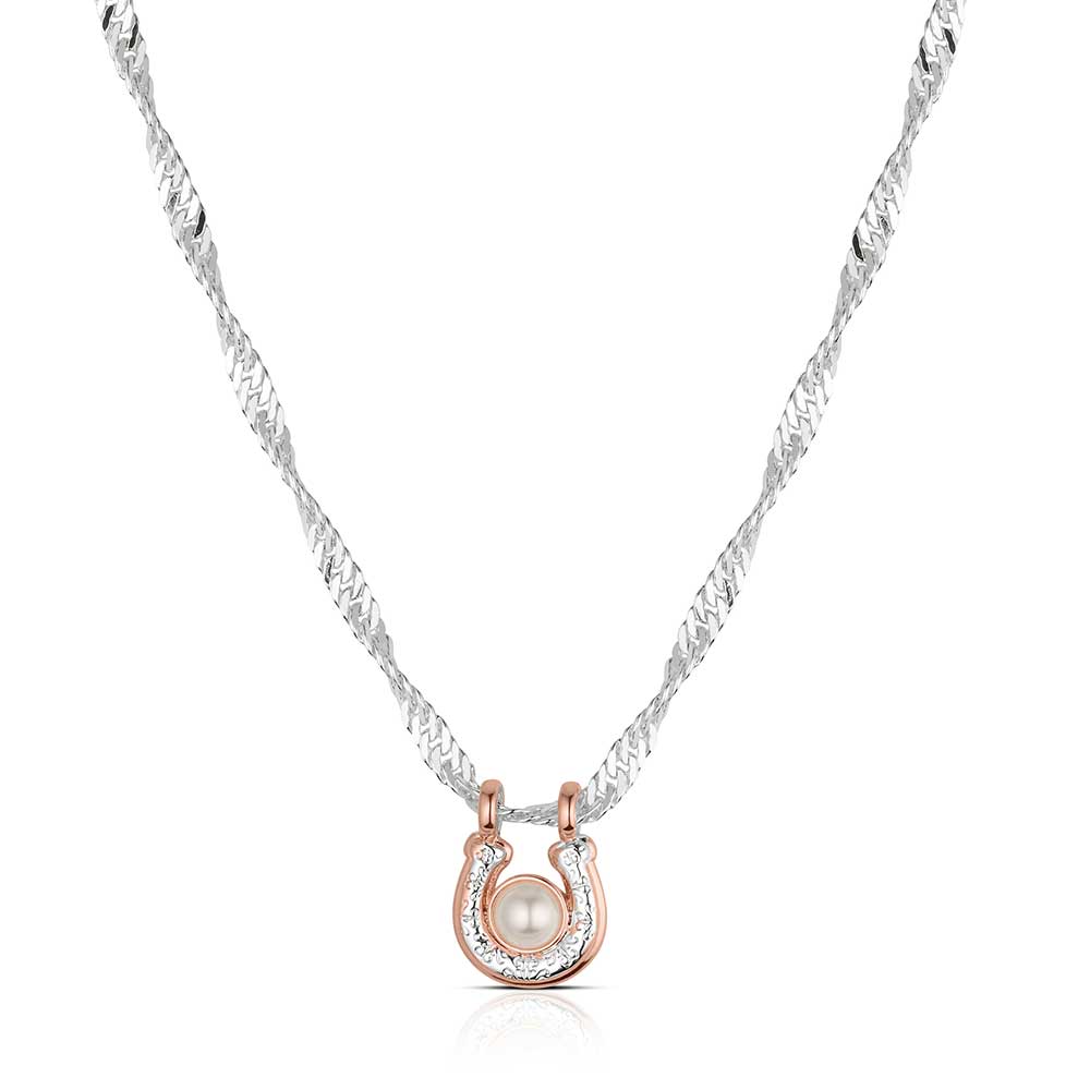 Necklace with a rose gold horse shoe pendant featuring a pearl on a white background