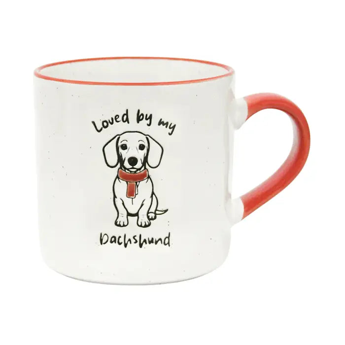 A white ceramic mug with a red handle and red interior rim, featuring a printed illustration of a dachshund wearing a red scarf with the text 'Loved by my Dachshund'.
