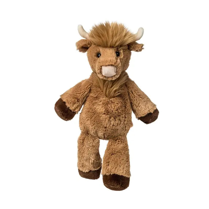 Plush toy of a brown cow with horns on a white background