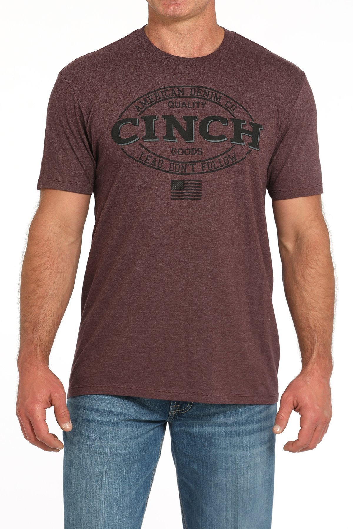 Cinch Lead Don't Follow Men's T-Shirt. Man wearing a brown t-shirt with 'Cinch' logo on a white background