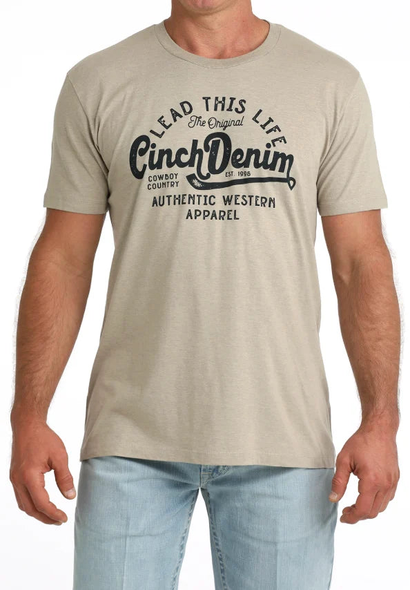 Man wearing a Cinch Denim t-shirt with branding on a white background