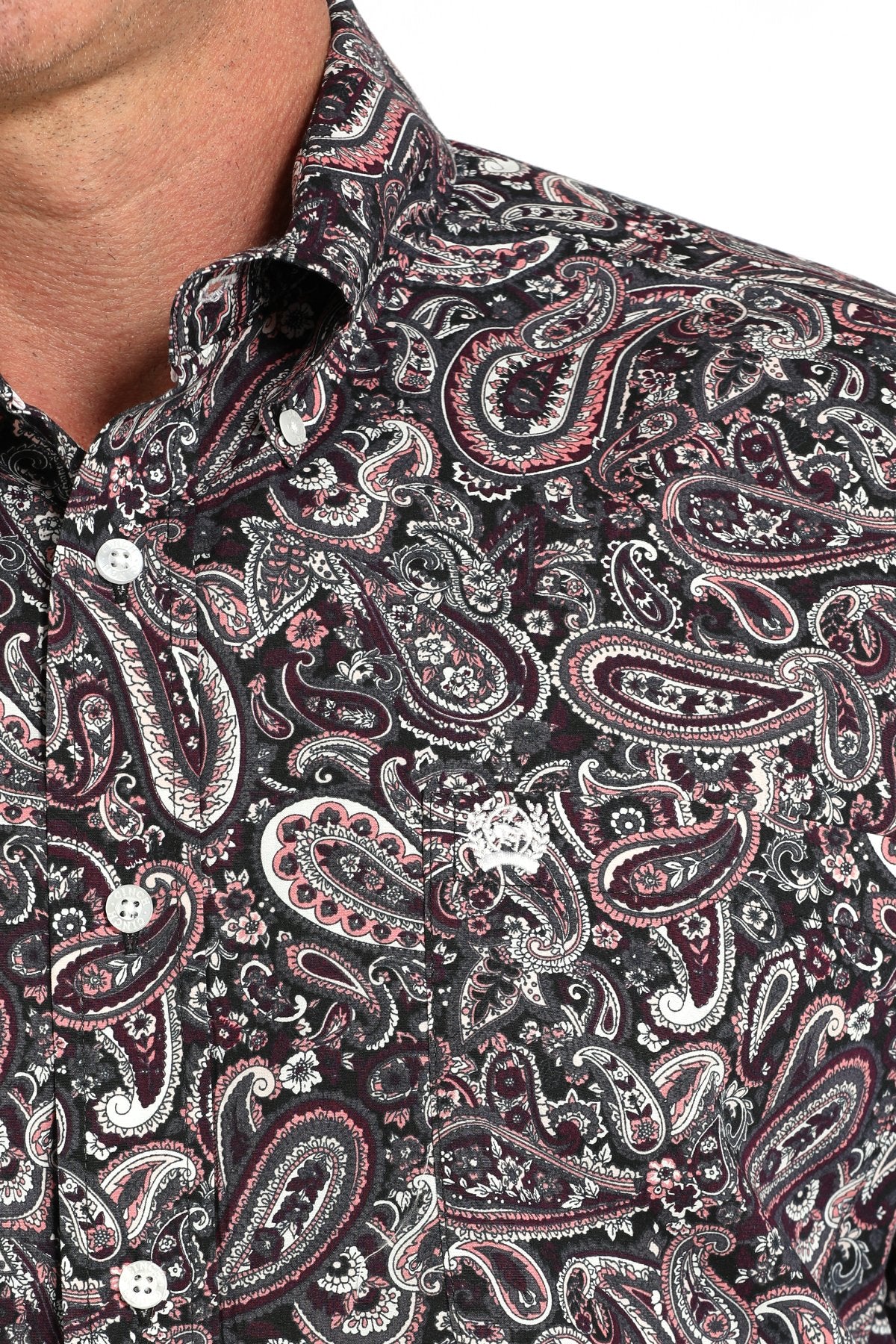 Cinch Men's Paisley Print L/S Western Shirt. Close-up of a black paisley patterned shirt with white accents.