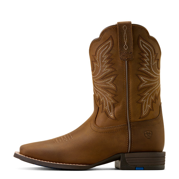 Brown cowboy boot with intricate stitching on a white background