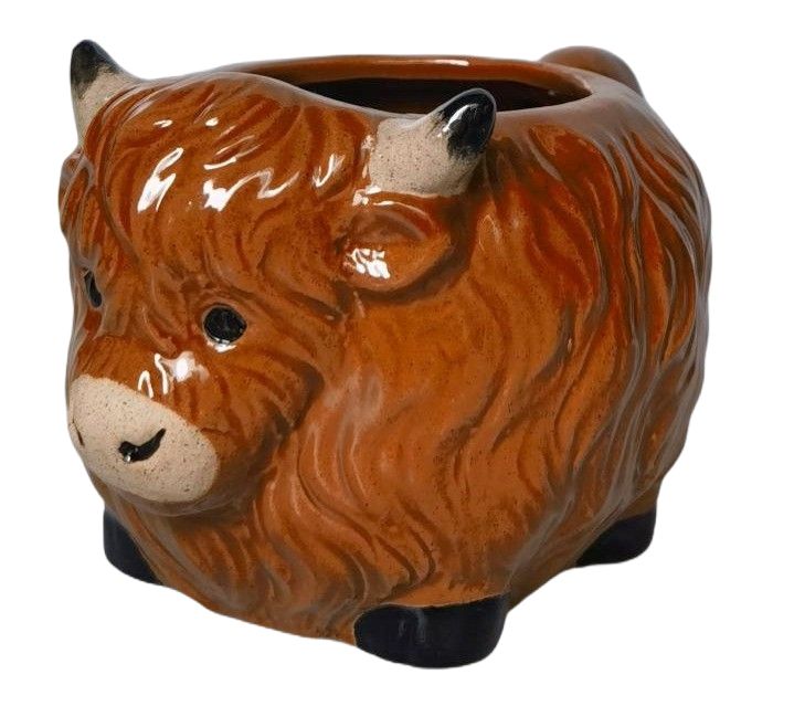 Ceramic mug shaped like a bull's head on a white background