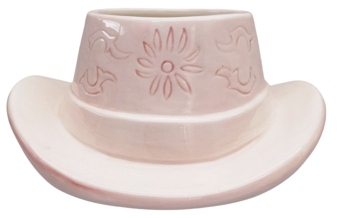 Urban Products 20cm Cowboy Hat Planter . Pink ceramic cowboy hat-shaped planter with embossed design on a white background