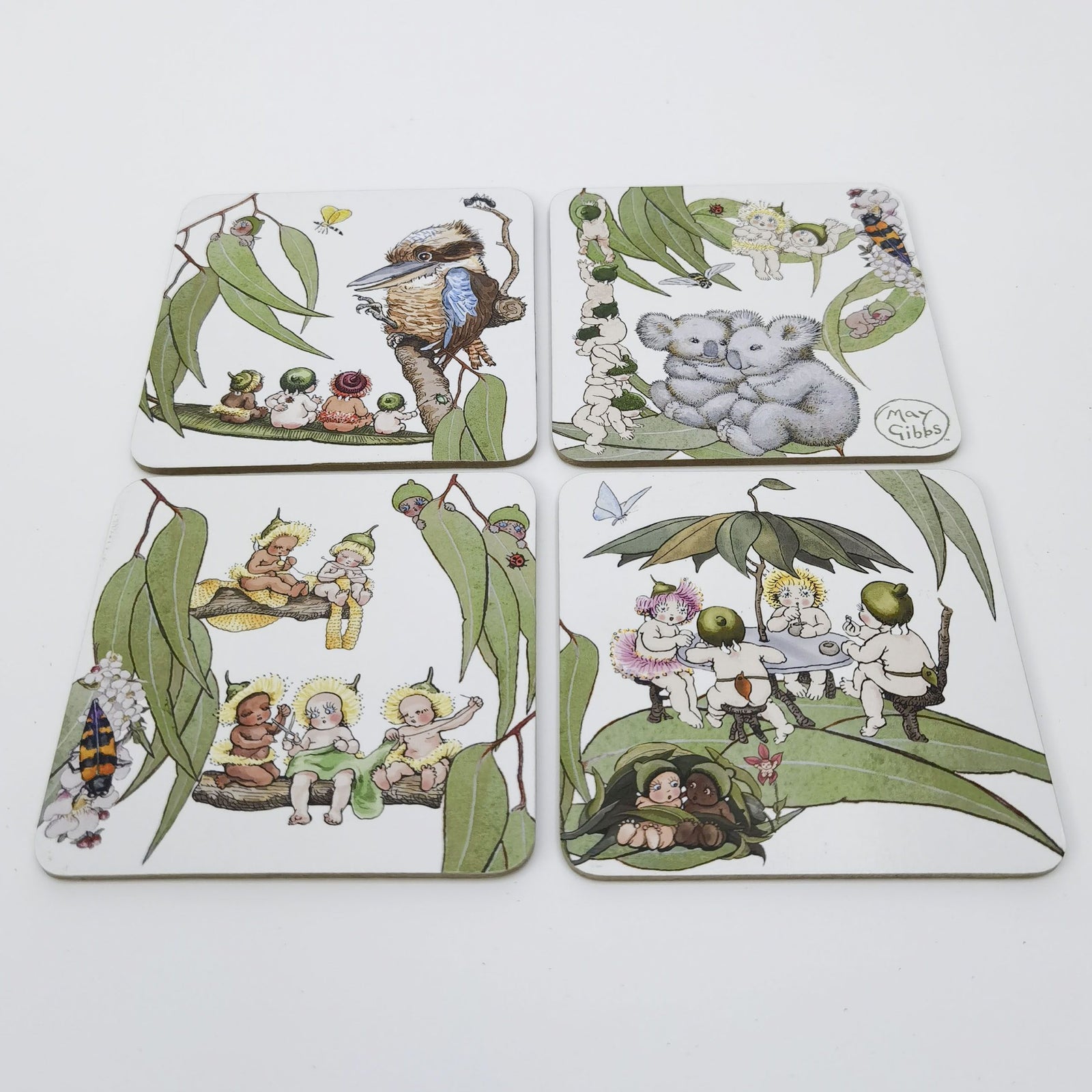 Urban Products May Gibbs Gumnut Baby Cork & MDF Coaster Set. Set of four coasters with illustrated designs on a white background
