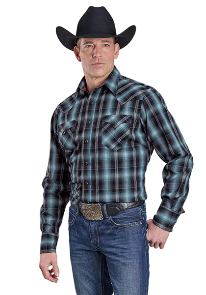 Roper Men's West Made L/S Western Shirt. Man wearing a plaid shirt, jeans, and a cowboy hat on a plain background