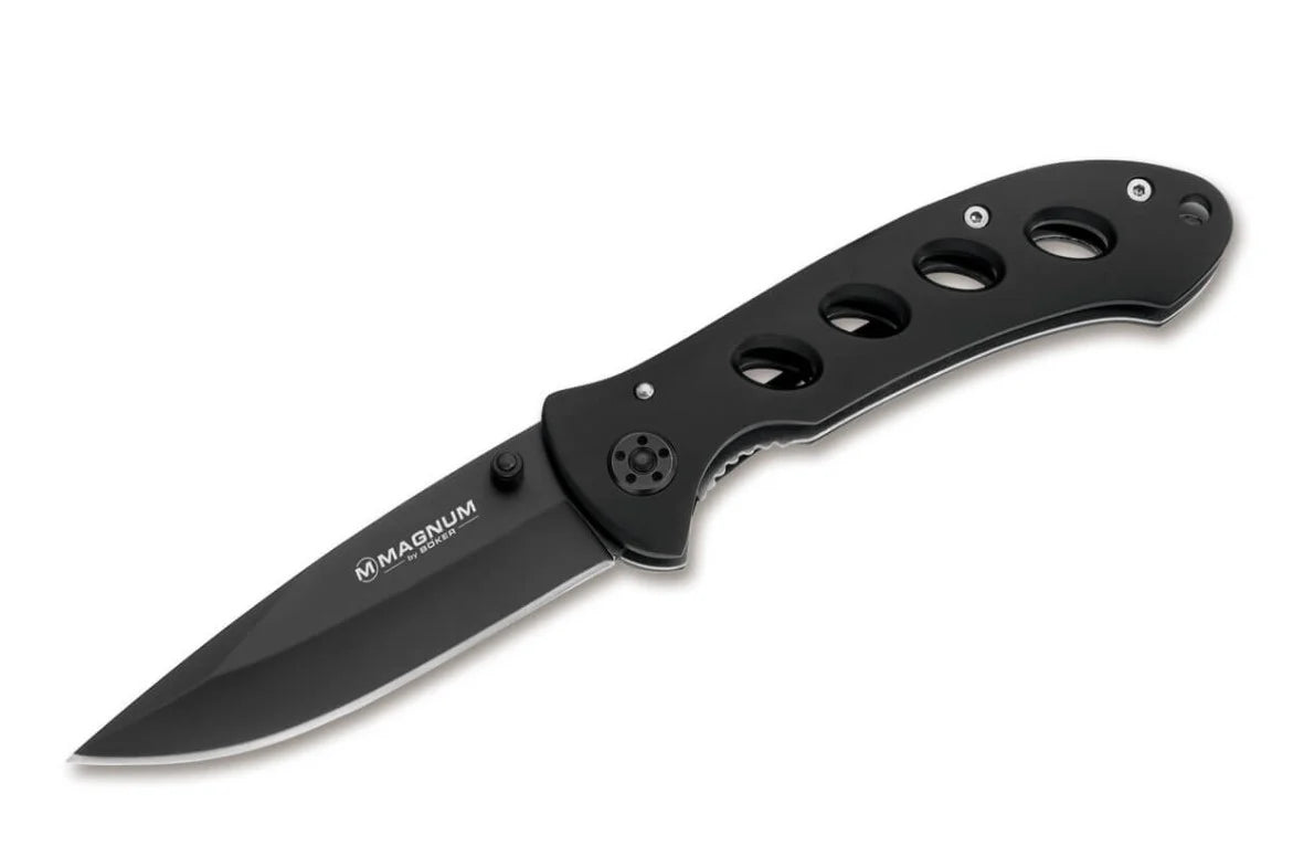Boker Magnum Shadow Pocket Knife. Black folding knife with 'Magnum' branding on a white background
