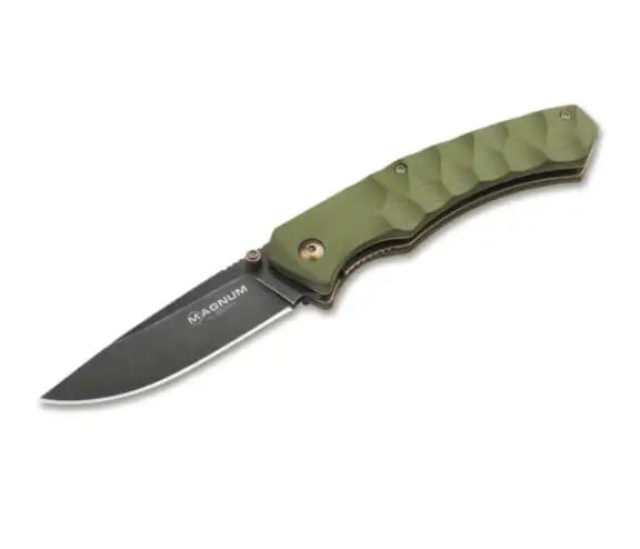 Boker Magnum Iguanodon Pocket Knife. A folding pocket knife with a dark stonewash blade and olive green G10 handle scales, featuring a thumb stud, anodized copper-colored screws and liners, and a deep carry clip.