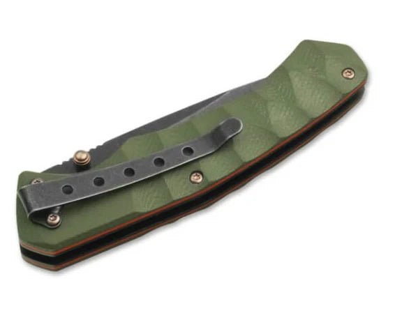 Boker Magnum Iguanodon Pocket Knife. A folding pocket knife with a dark stonewash blade and olive green G10 handle scales, featuring a thumb stud, anodized copper-colored screws and liners, and a deep carry clip.