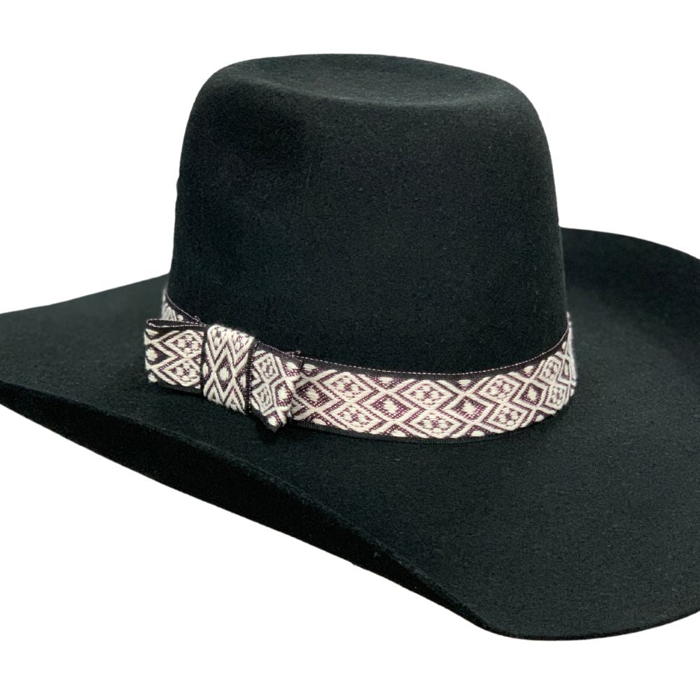 Twister Shimmer 1 1/4" Hatband. A black hat with a wide-brimmed hatband featuring a white body with black outlines and pink shimmering flakes.