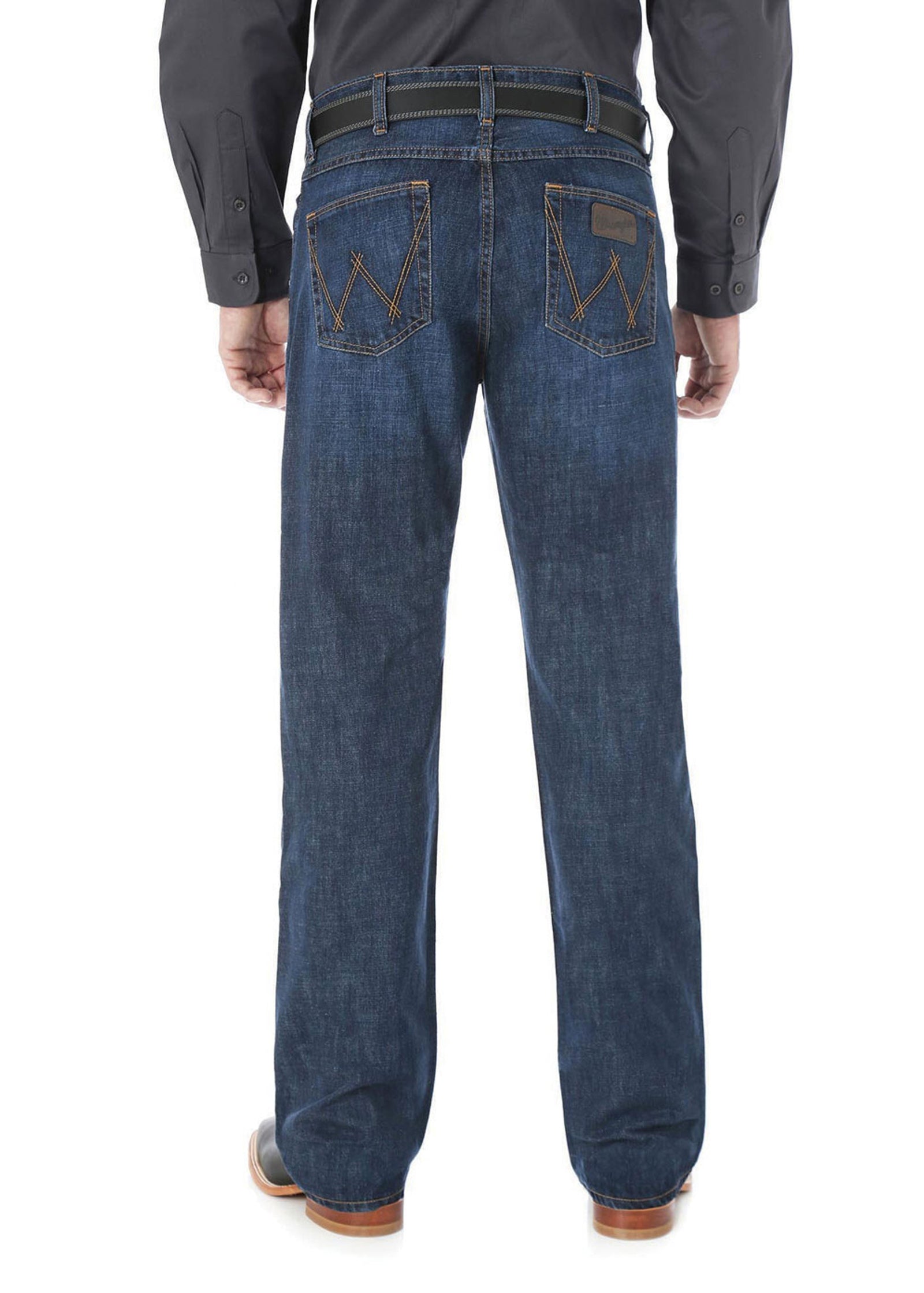 Wrangler Men's 20X Competition Slim Bootcut Jean. Person wearing blue jeans with a brown belt and shoes on a white background