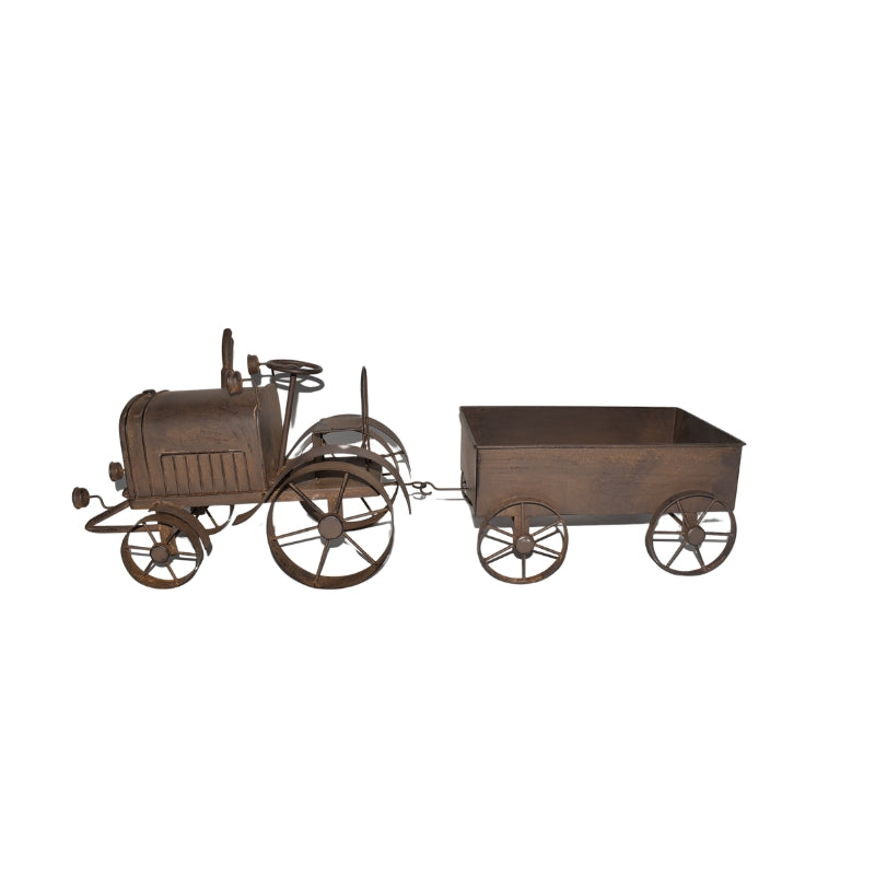 Rustic metal decorative sculpture of a vintage tractor pulling a small cart, shown against a plain white background.