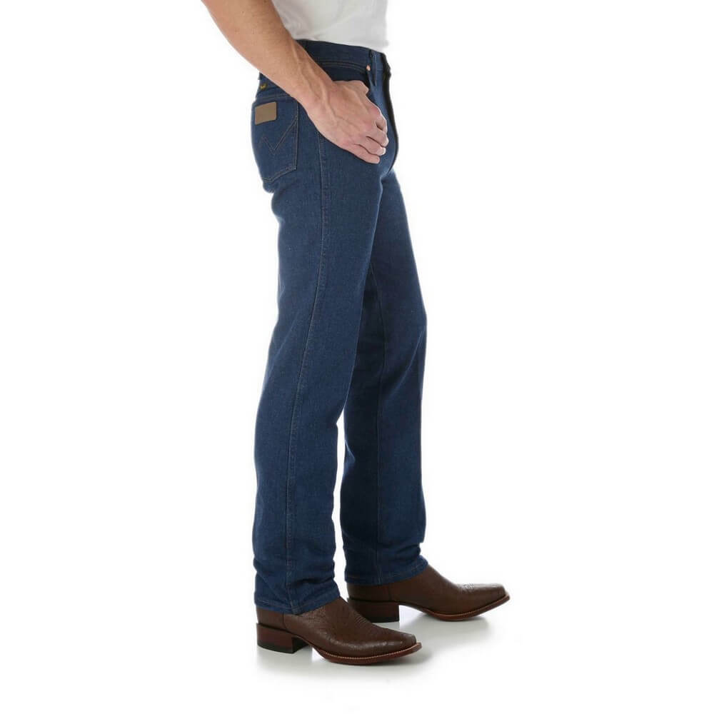 Wrangler Men's Prewashed Slim Fit Jean. Two views of a man wearing Wrangler Men's Prewashed Slim Fit Jeans. Front view shows the jeans' fit and waist, while the back view highlights the five-pocket design and button closure.