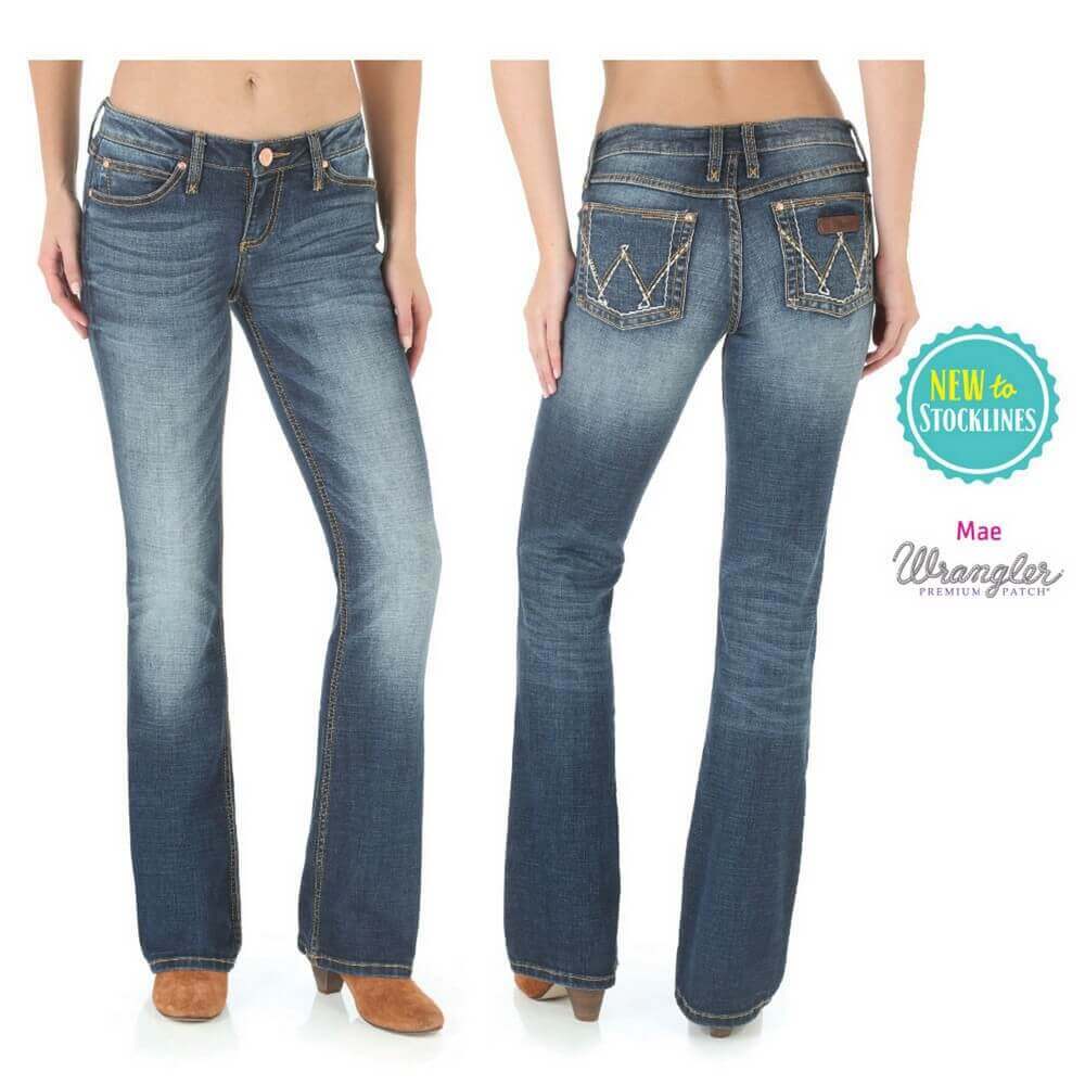 A pair of Wrangler women's mid-rise blue jeans with a boot cut style, featuring a 5-pocket design and a label indicating 'NEW STOCKLINES'.
