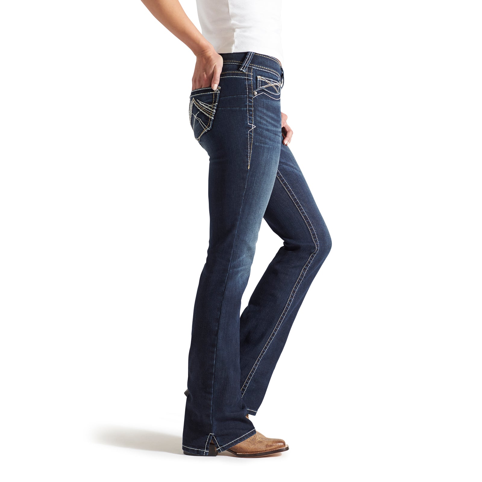 Ariat Women's Real Mid Rise Boot Cut Jean. Person wearing blue jeans with a plain background