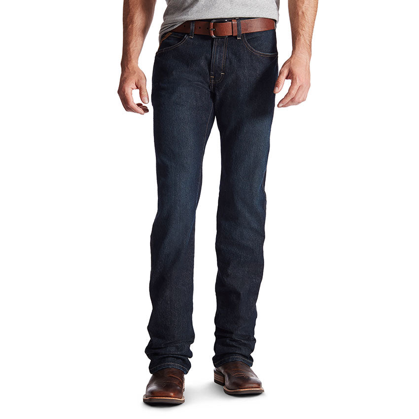 A man wearing a pair of Ariat Men's Rebar M5 Slim Straight Leg Jeans.