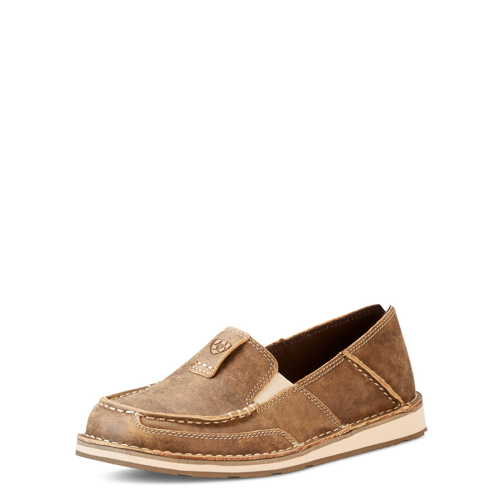 Ariat Women's Cruiser Slip On. A brown women's slip-on cruiser shoe with a suede upper and a rubber outsole.