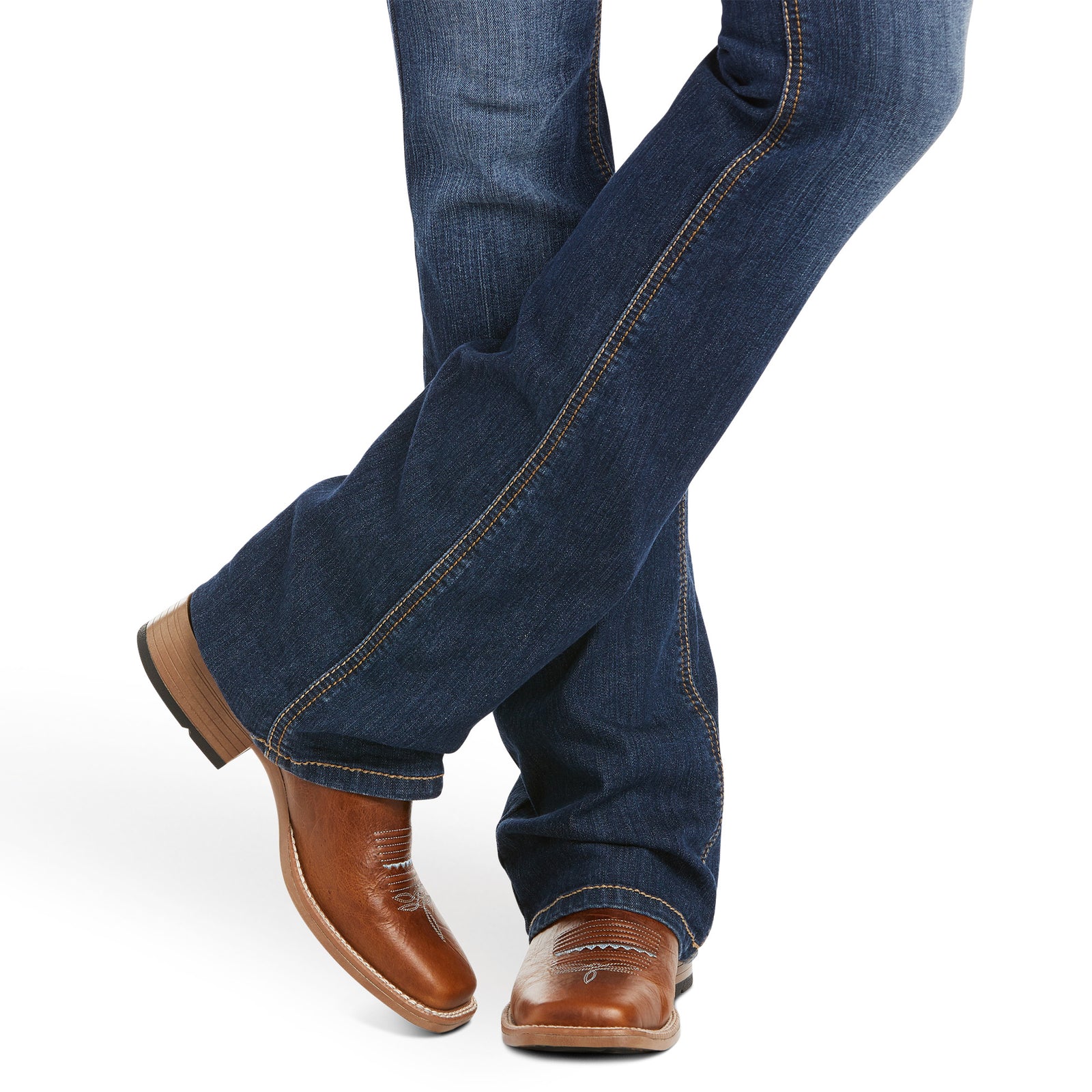 Ariat Women's Rosa Perfect Rise Boot Cut Jean. Blue jeans and brown shoes on a white background