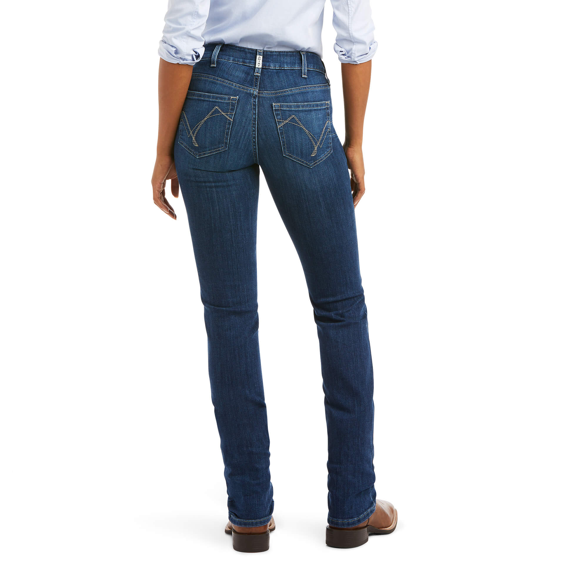 Ariat Women's Abby Perfect Rise Straight Leg Jean. Person wearing blue jeans and brown shoes on a white background