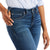 Ariat Women's Abby Perfect Rise Straight Leg Jean. Person wearing blue jeans with a white background