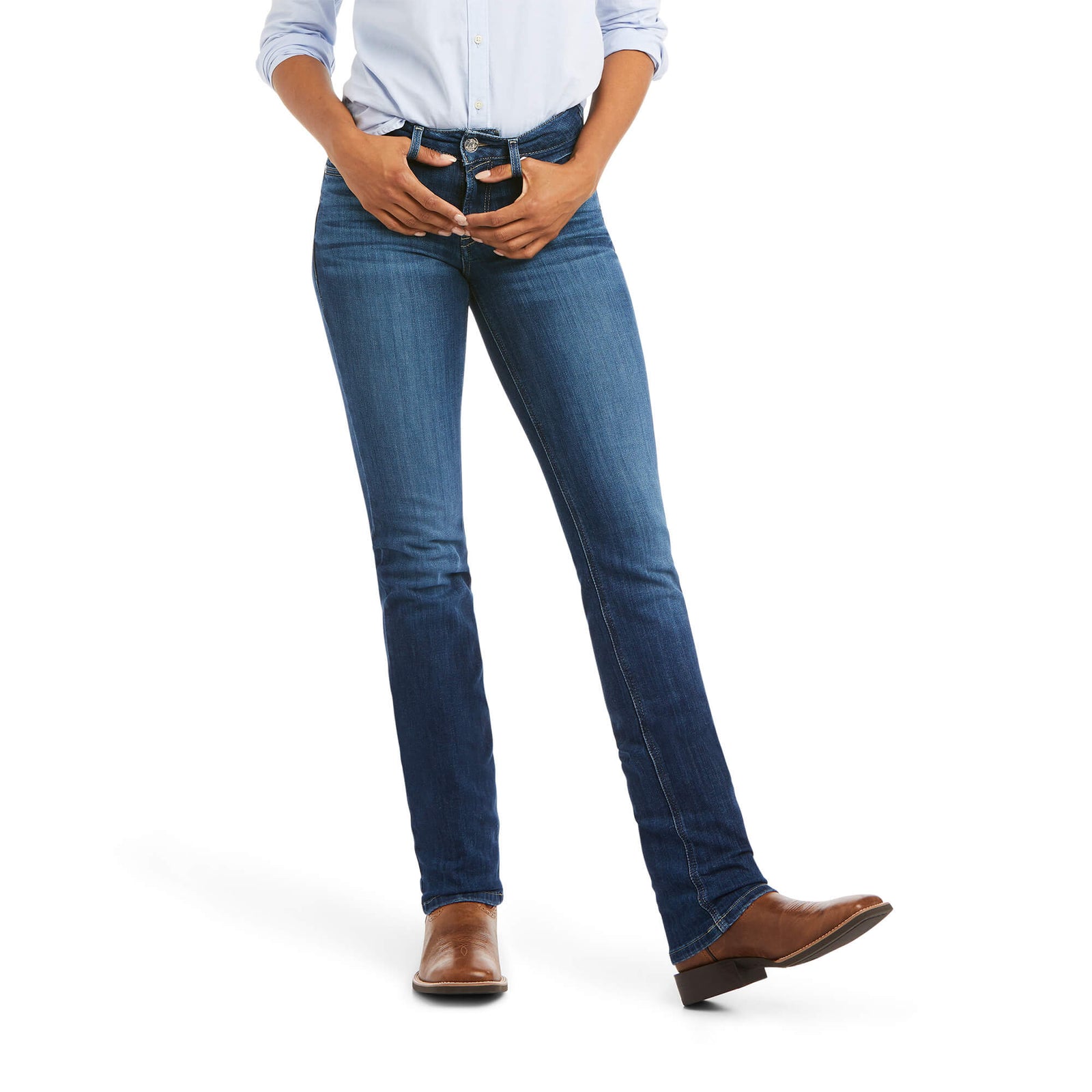 Ariat Women's Abby Perfect Rise Straight Leg Jean. Person wearing blue jeans and brown shoes on a white background