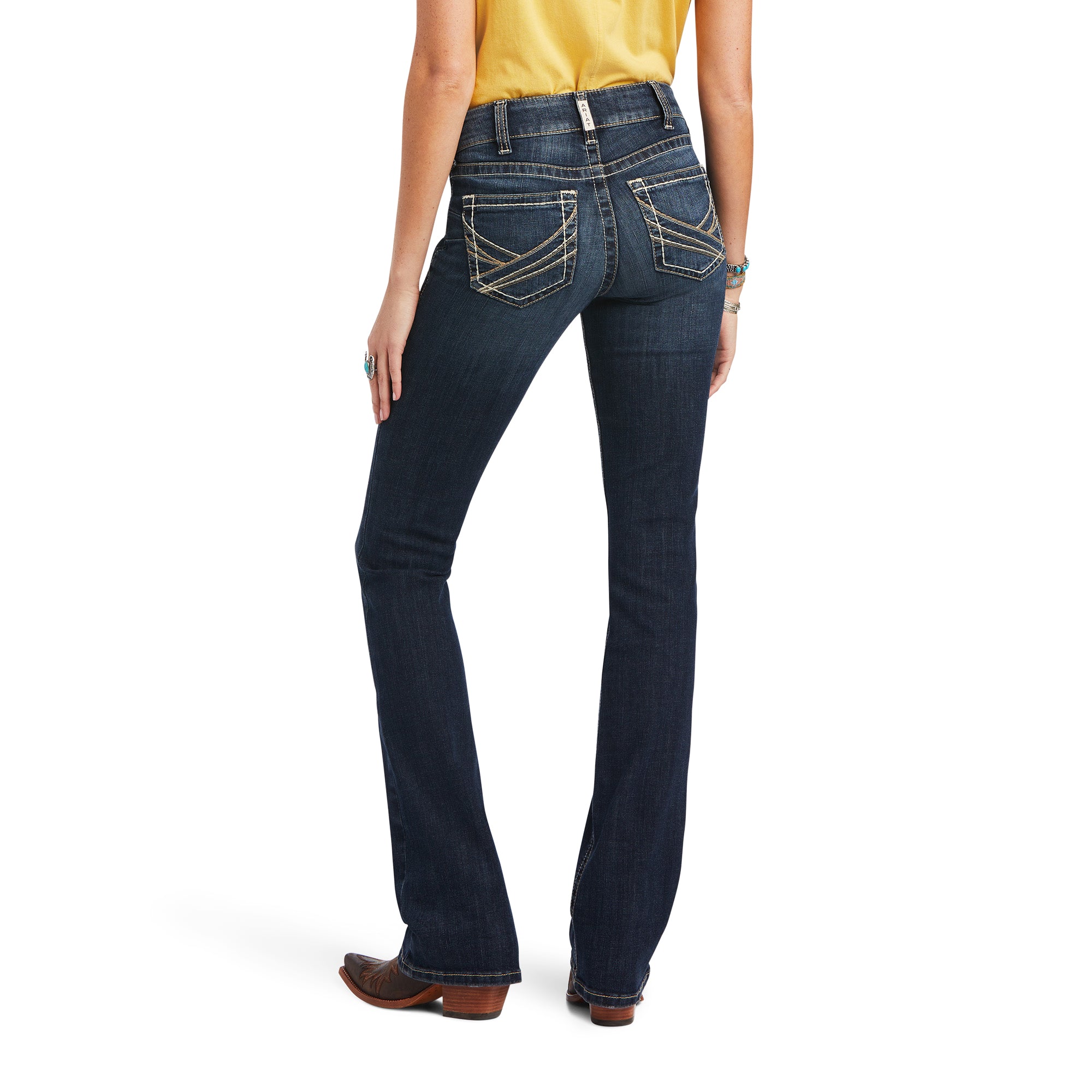 Ariat Women's Lexie Perfect Rise Boot Cut Jean. Person wearing blue jeans on a white background