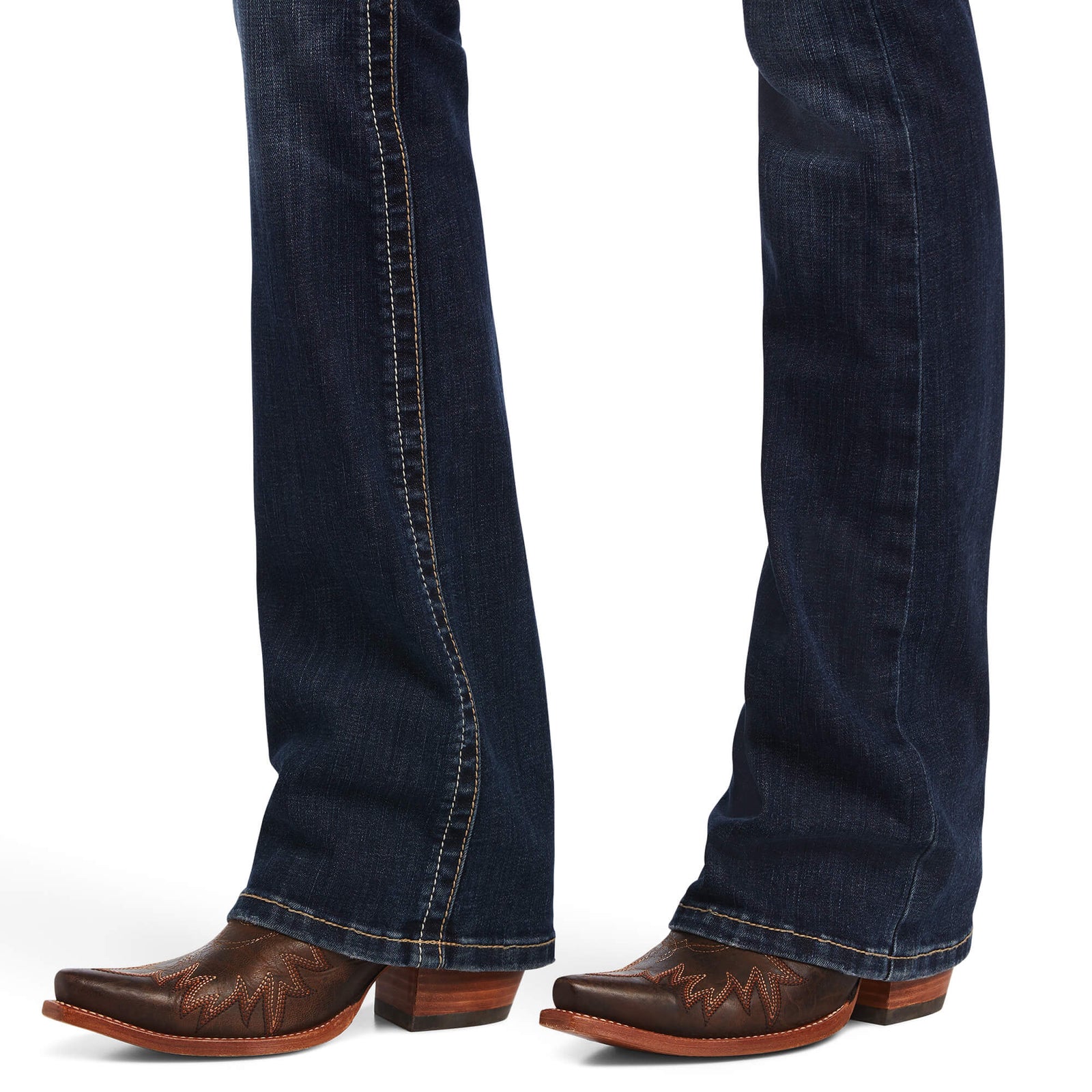 Ariat Women's Lexie Perfect Rise Boot Cut Jean. Blue jeans worn with brown boots on a white background