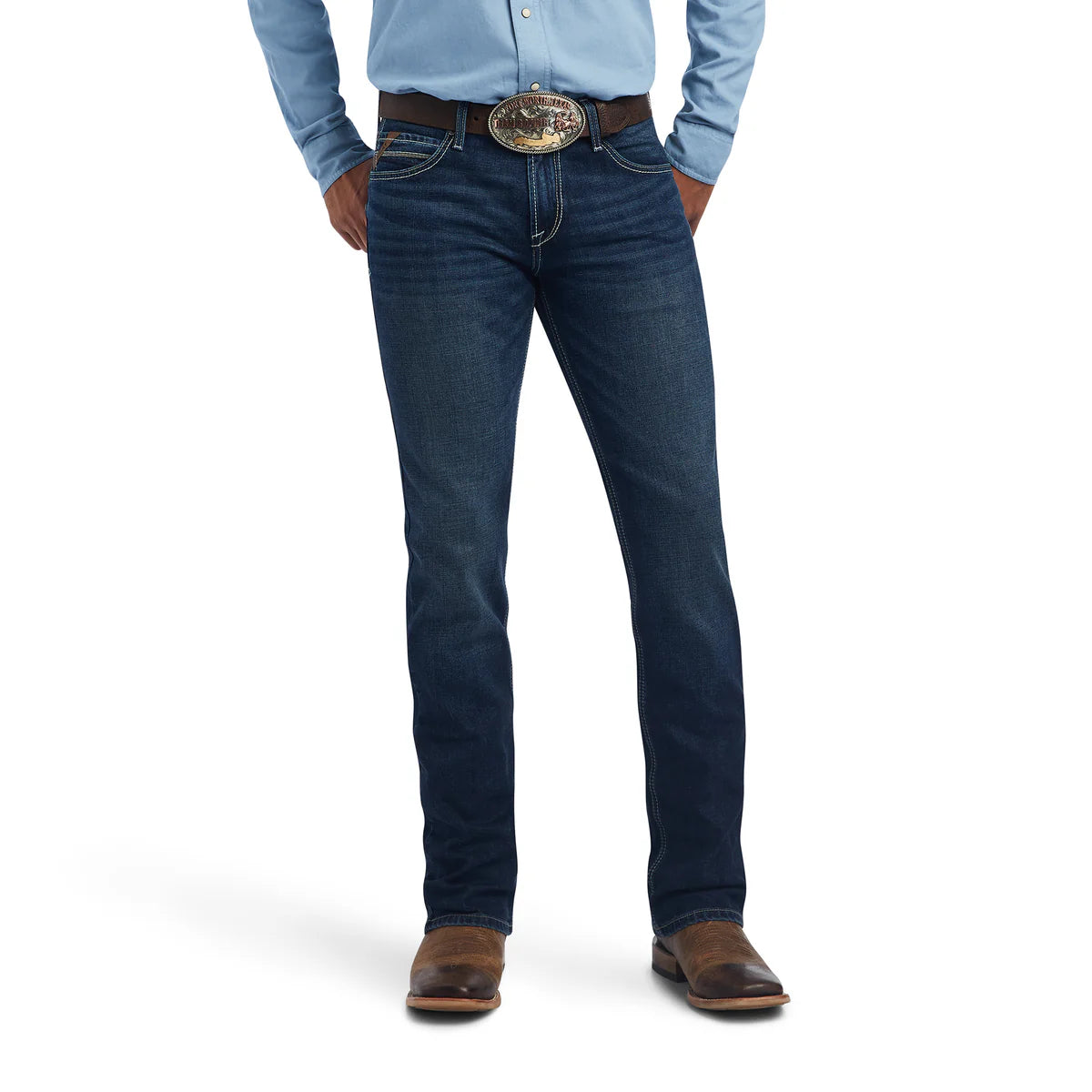 Person wearing blue jeans with a belt and brown shoes on a white background