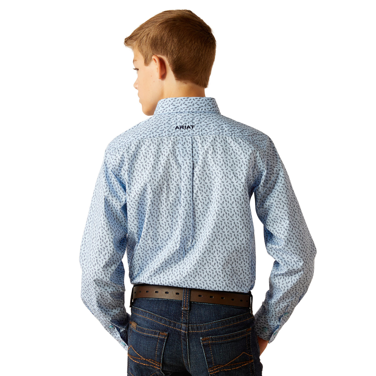 Ariat Boy's Rowan Classic Fit L/S Western Shirt. A boy wearing a long-sleeved blue and white geometric patterned Western shirt by Ariat, paired with jeans.
